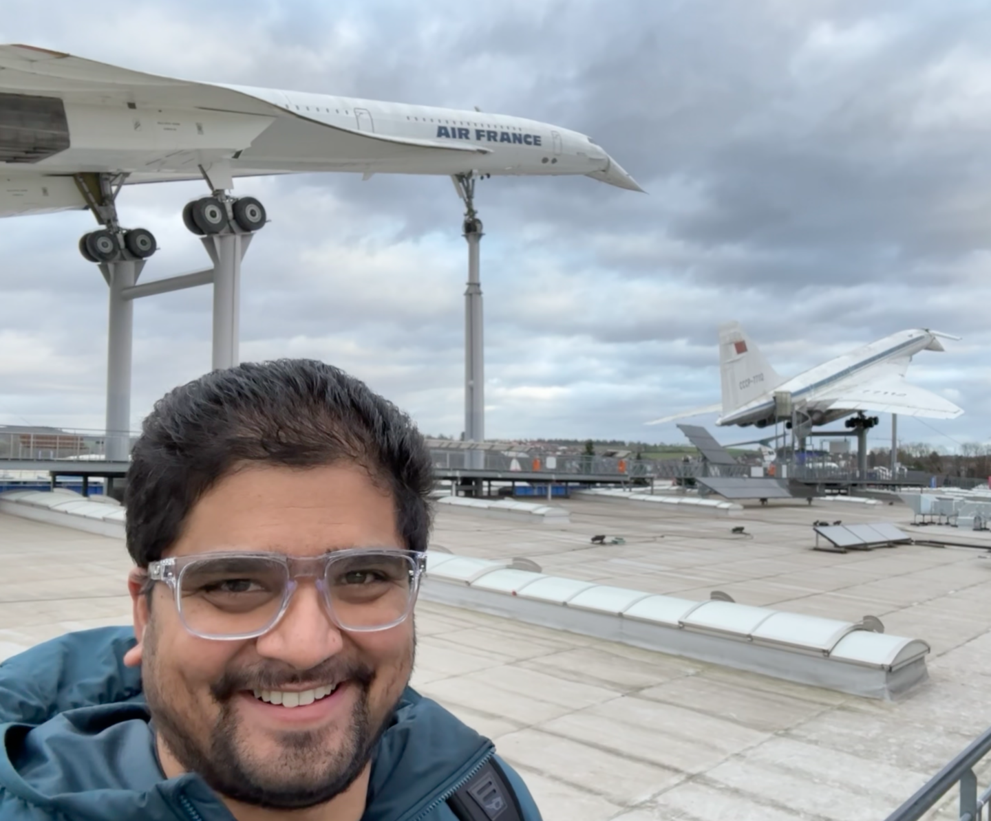 Boom Supersonic's Vikram Kumar, an aerodynamics engineer standing in front of the Concorde. 
