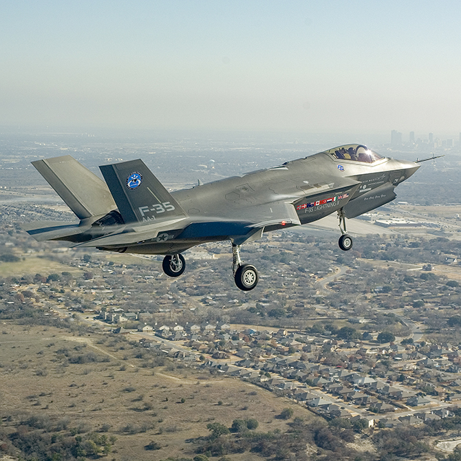 This image shows the first flight of the F-35, a fighter jet capable of speeds up to Mach 1.6.